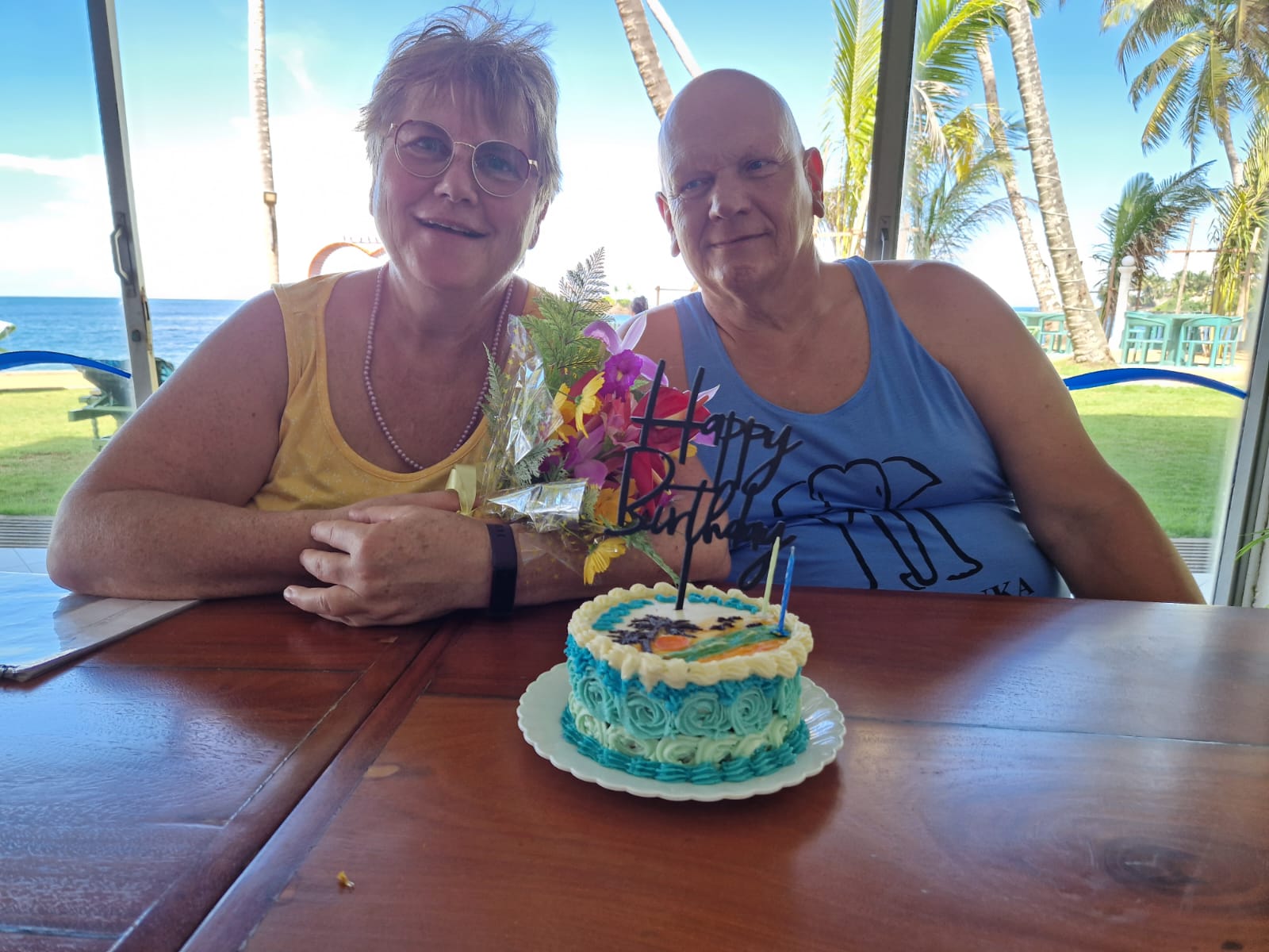 A birthday cake and flowers prepared for guests during their Sri Lanka journey