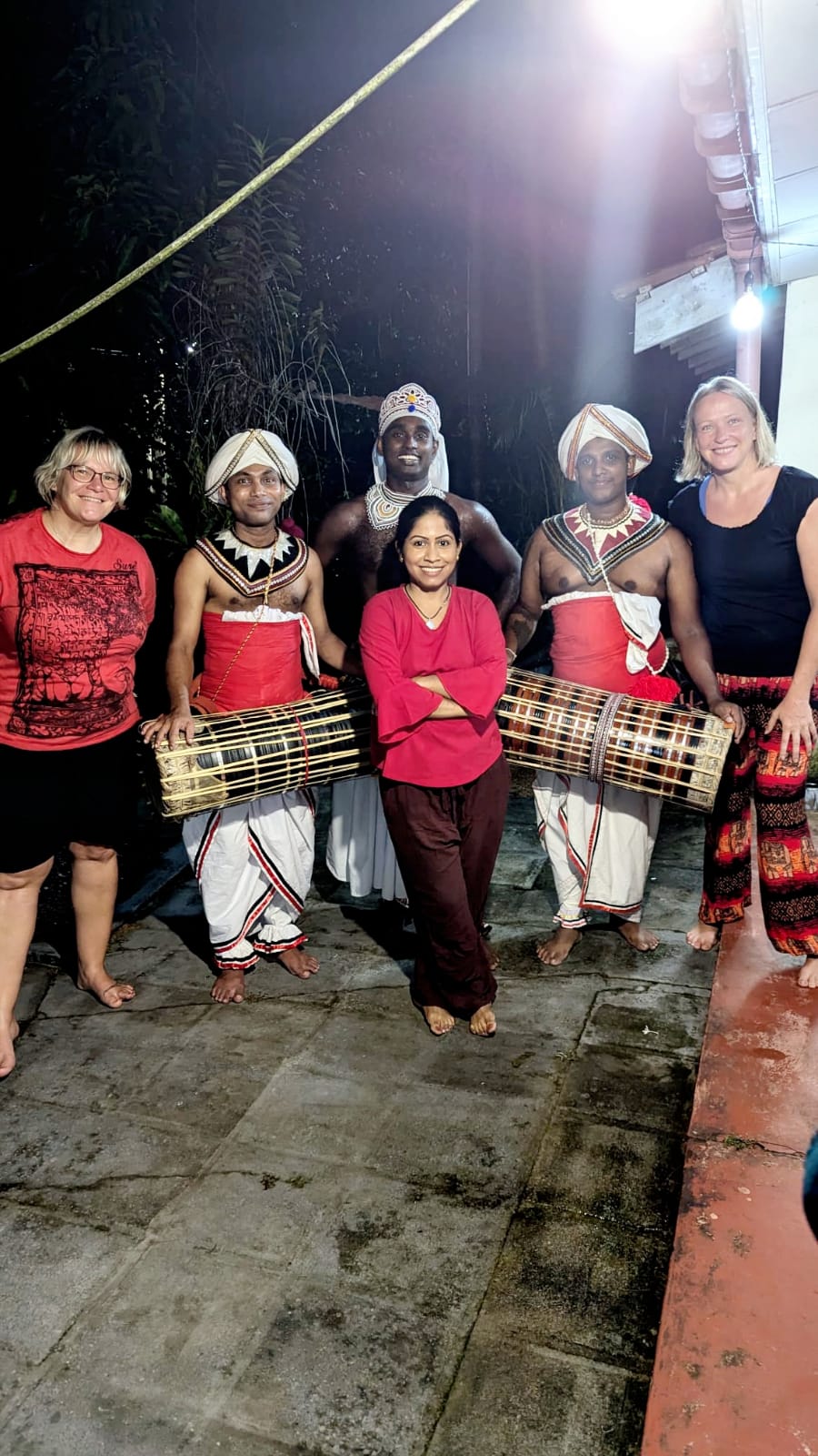 Guests meeting traditional Kandyan dancers and drummers after a cultural performance