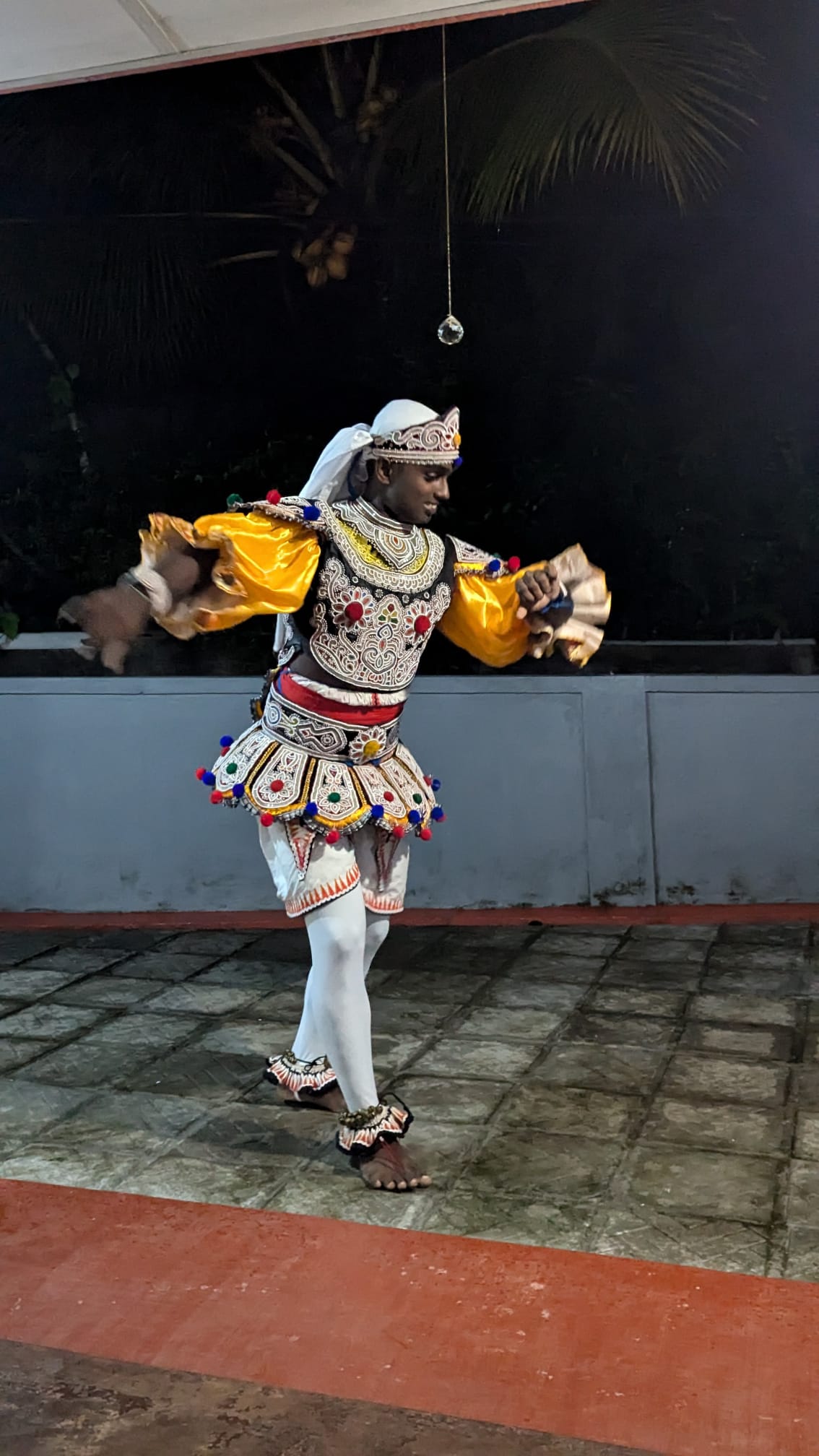 A colourful Kandyan dancer performing traditional Sri Lankan choreography