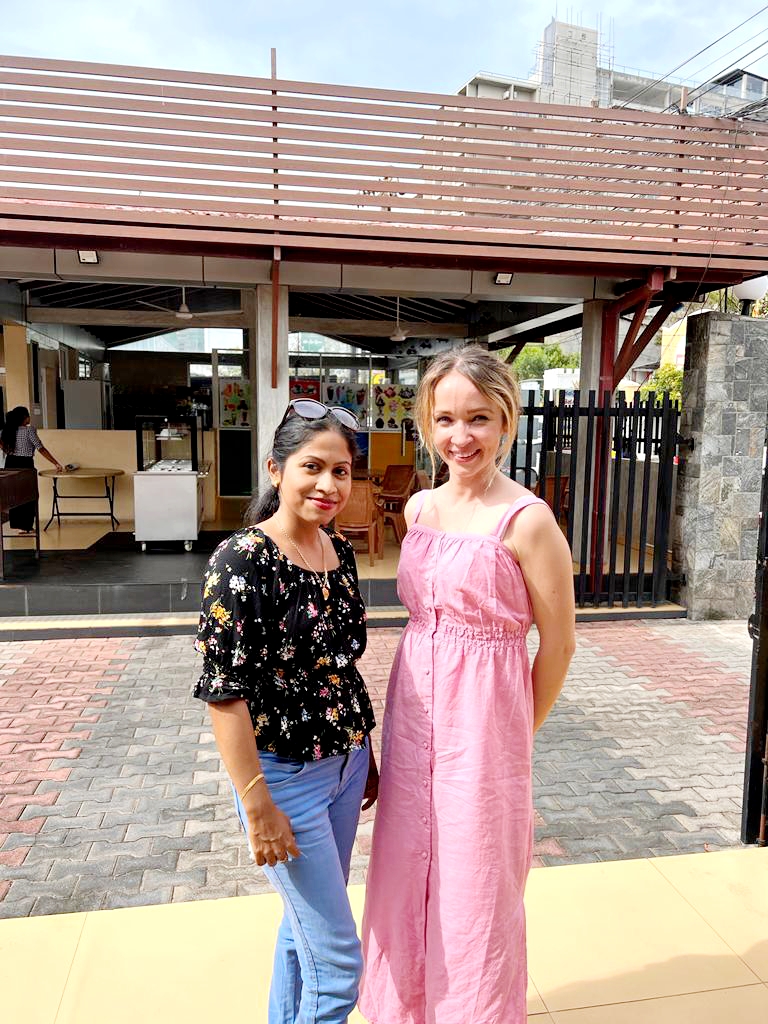 A guest and local host smiling together at the start of their private tour